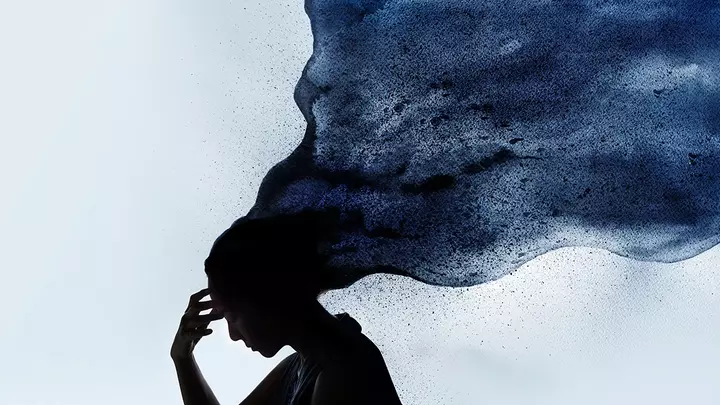 A dusty outline of a woman's head with a lof of smokey hair that looks like a storm cloud and stress flowing to the upper right quadrant